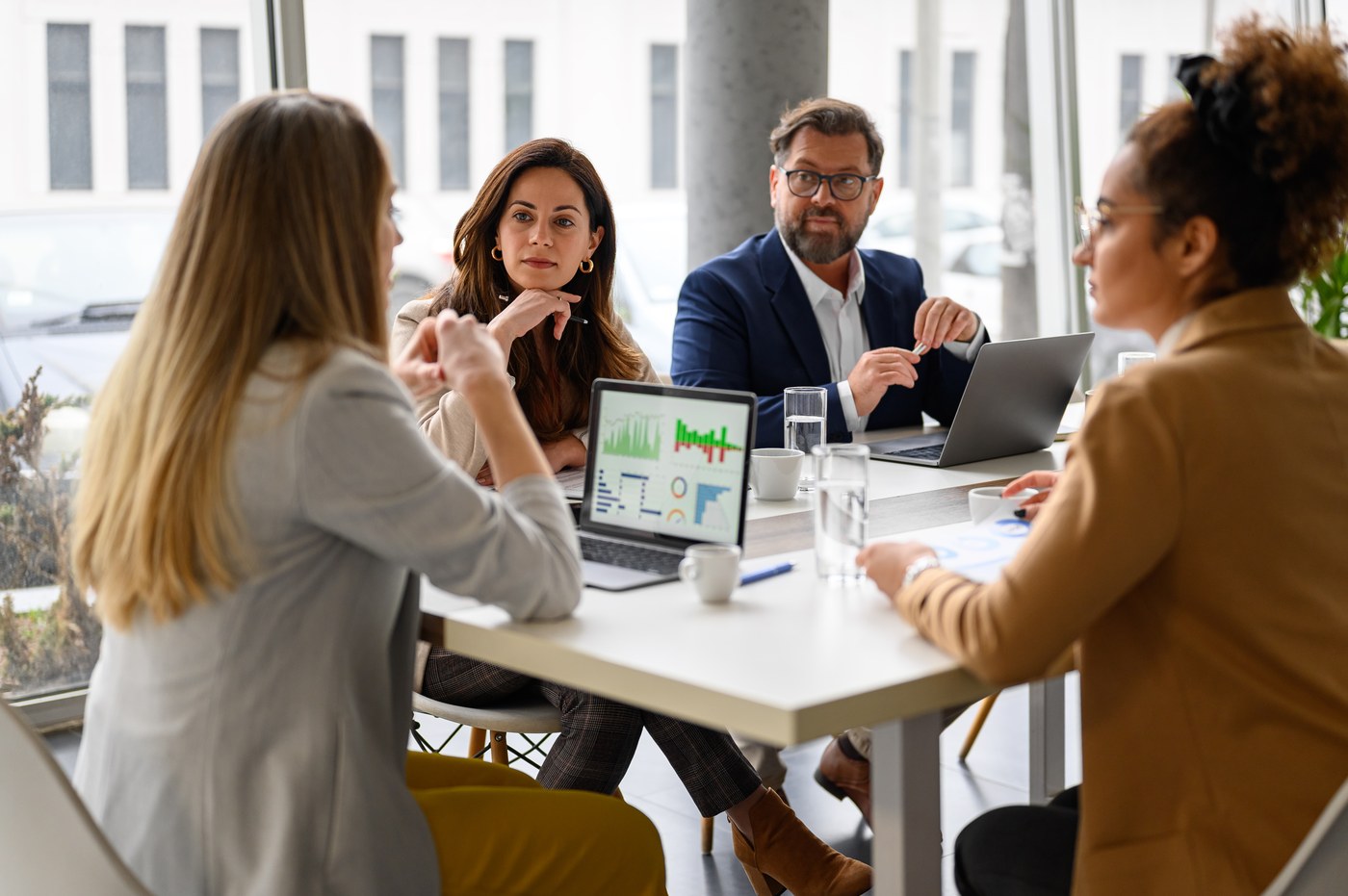 Business team reviewing a report at a meeting